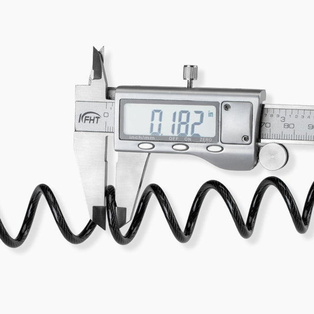 Image of the 4 digit combination lock's steel wire width being measured at 0.182 inches