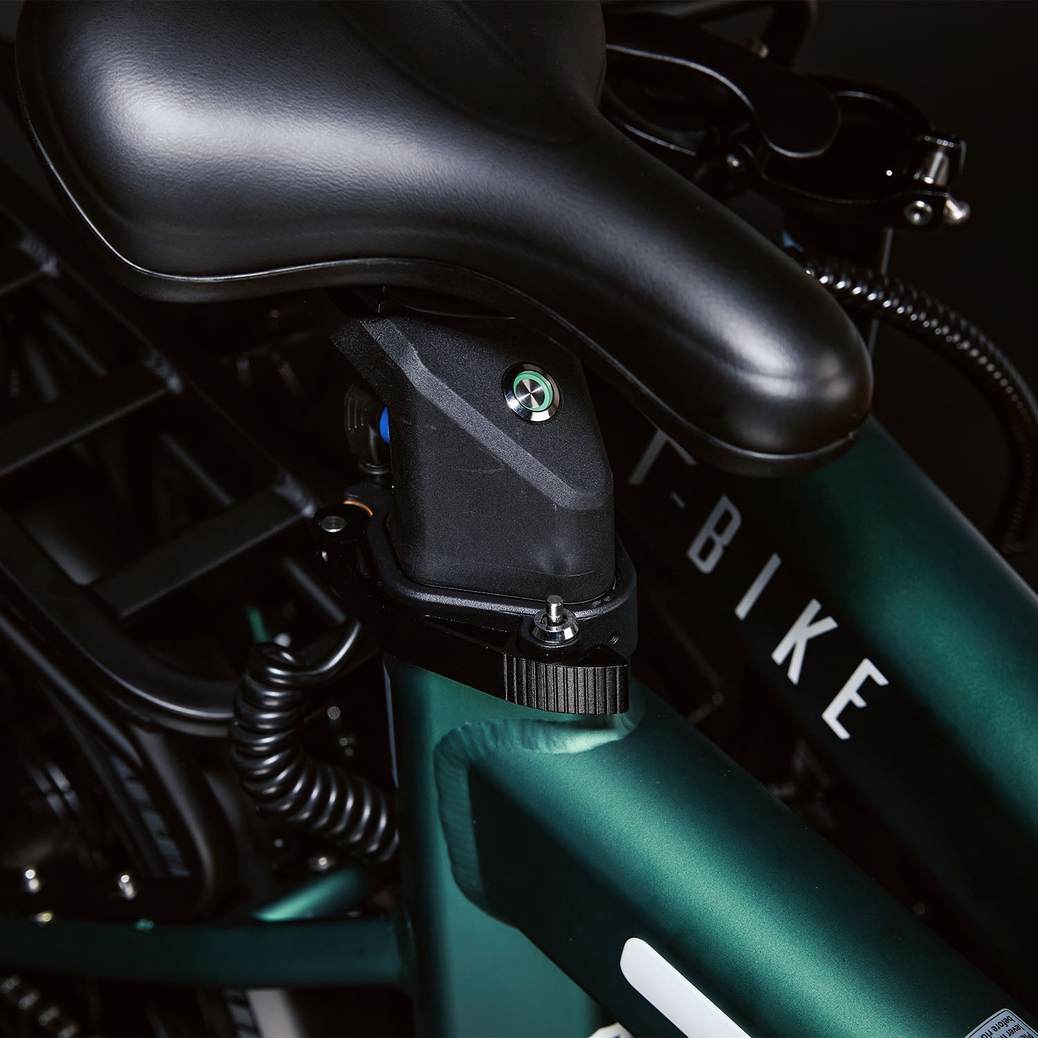 Image of the Green CITY 250 folding E-Bike displaying the seatpost battery and locking mechanism