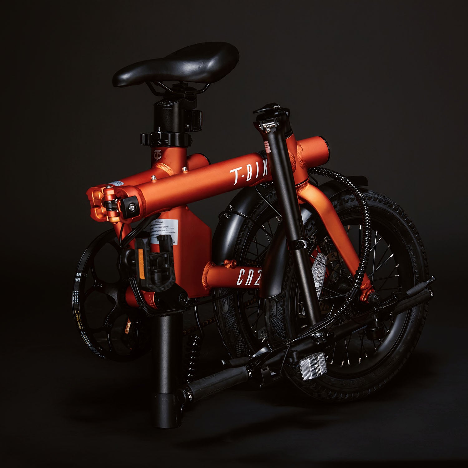 Image of the orange Compact Rider folded up compactly