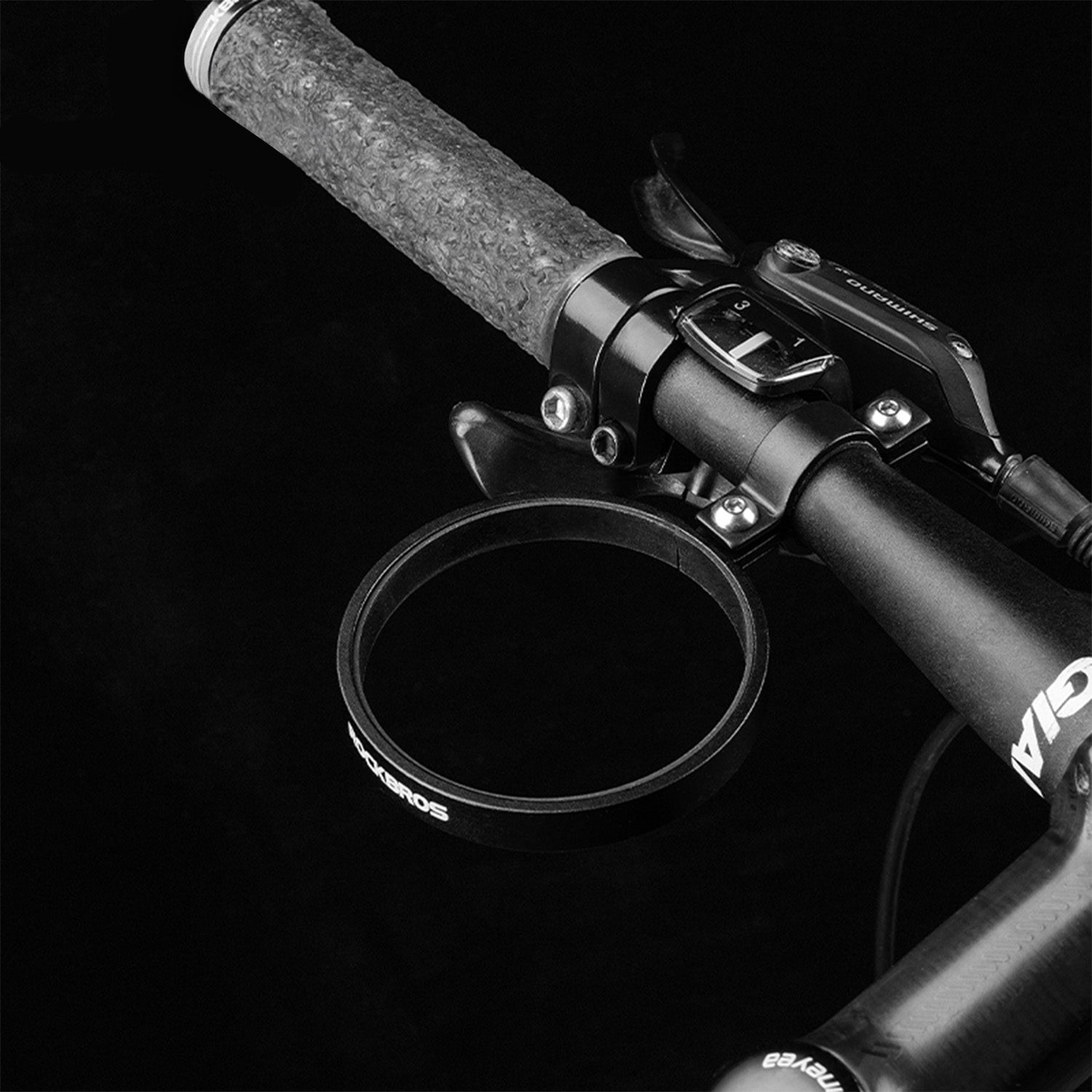 Image of aluminium cup holder attached to bike handle bars