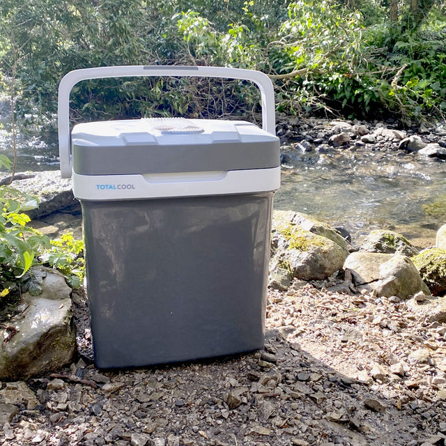 Image of the grey Eco-chill 24 outside next to a stream