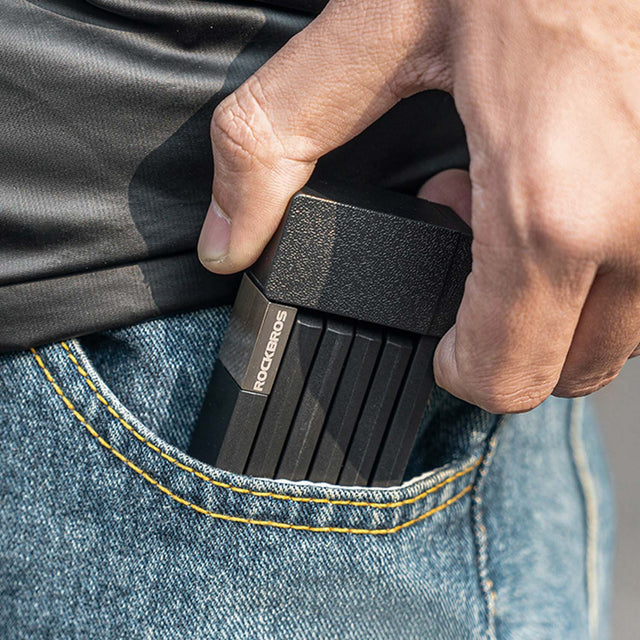 an image of the folding lock being compact enough to fit inside of a trouser pocket