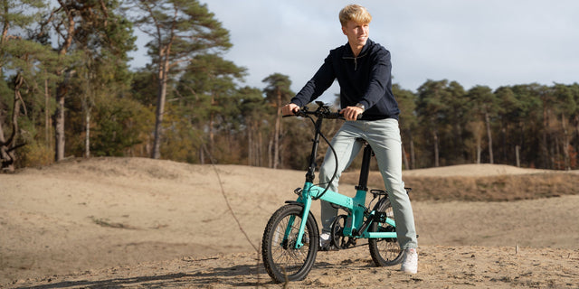Image of a rider on an electric folding commuter bike