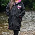 Front view of the black and pink T-Robe in an outdoor setting