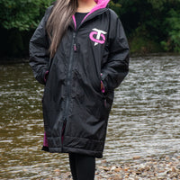 Front view of the black and pink T-Robe in an outdoor setting