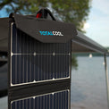 Lifestyle image of the TS100 solar panel being hung off the side of an outdoor awning